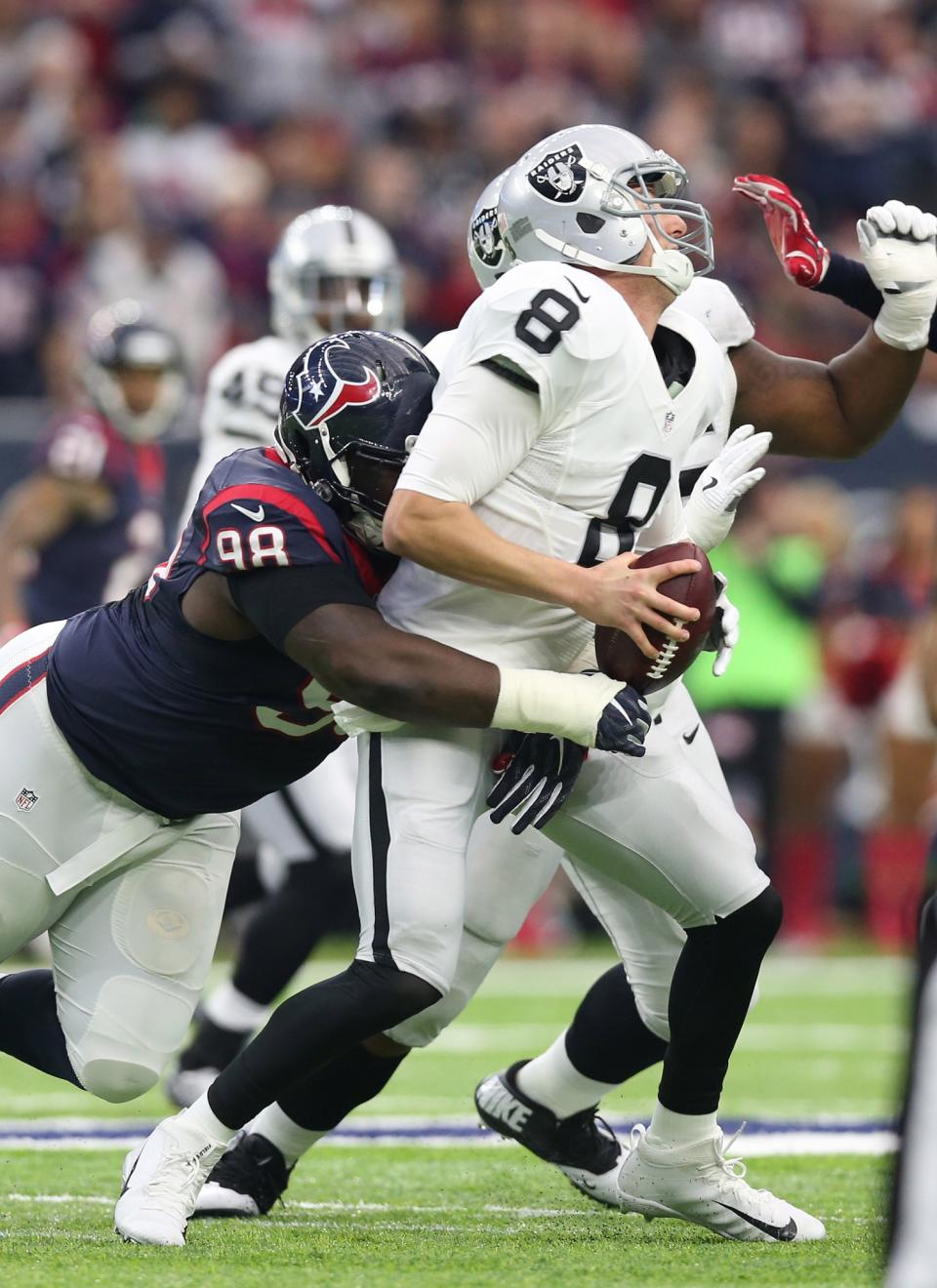 <p>Oakland Raiders quarterback Connor Cook (8) is sacked by Houston Texans nose tackle D.J. Reader (98) during the first quarter in the AFC Wild Card playoff football game at NRG Stadium. Mandatory Credit: Matthew Emmons-USA TODAY Sports </p>