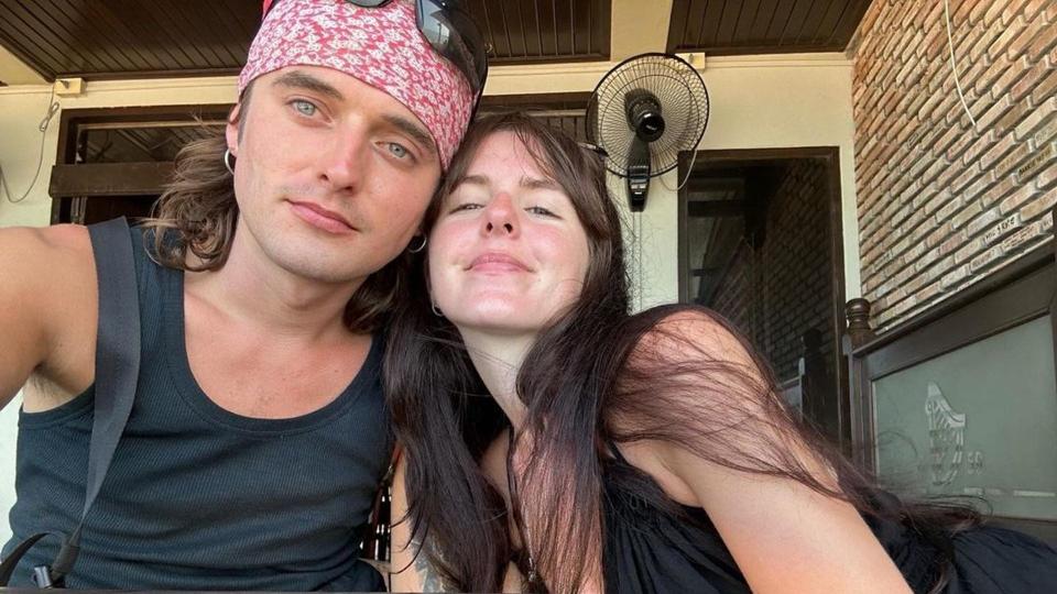 Coleen Nolan's daughter Ciara wearing a black dress and cuddling her fiance Max