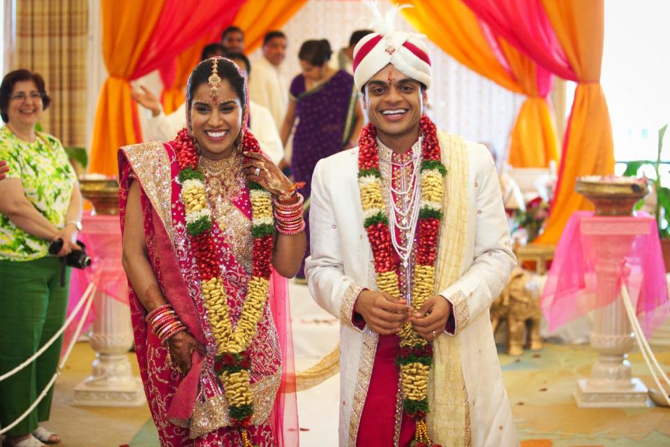 This photo provided by Seaport Hotel and World Trade Center in Boston shows the wedding of Payal Agrawal and Sanjay Divakaran. Couples wishing to have ethnic food as part of their wedding celebration at the Seaport Hotel and World Trade Center in Boston are able to use outside caterers. Many hotels and banquet halls have begun to allow the exceptions for Indian and Kosher celebrations because their chefs are not trained to cook those foods. (AP Photo/Seaport Hotel and World Trade Center, Boston, Binita Patel Photography)