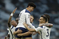 Tottenham's Son Heung-min celebrates in the arms of Harry Kane after scoring the opening goal during the English Premier League soccer match between Tottenham Hotspur and West Ham United at the Tottenham Hotspur Stadium in London, England, Sunday, Oct. 18, 2020. (AP photo/Matt Dunham, Pool)