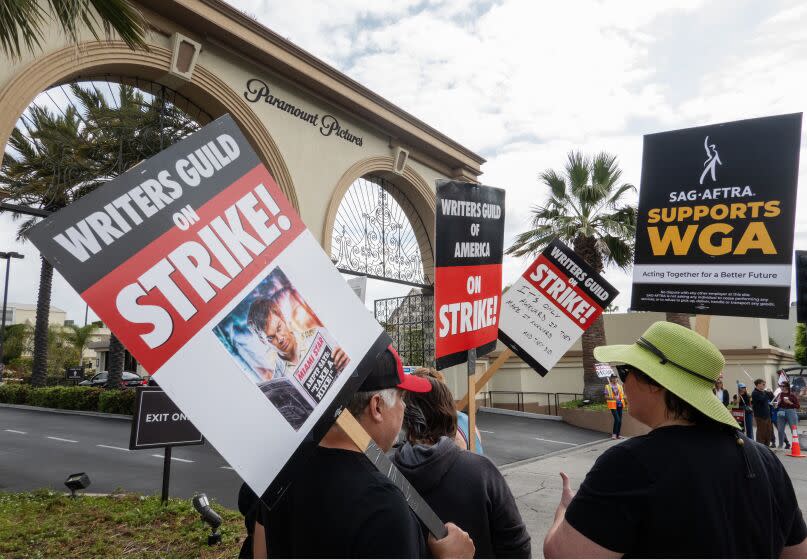 LOS ANGELES, CA - JUNE 06: Writers Guild of America members with support from SAG-AFTRA, strike at Paramount Studios in Los Angeles, CA on Tuesday, June 6, 2023 as the strike enters the sixth week. The Directors Guild of America recently signed a new contract and the screen actors guild SAG-AFTRA has authorized a strike at the end of the month if they cannot come to terms with the studios. (Myung J. Chun / Los Angeles Times)