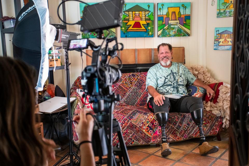 The Outwords Archive director of photography Kate Kunath prepares to interview and record Puerto Rico-born disabled gay activist Miguel Criado in Palm Springs, Calif., on August 12, 2022. 