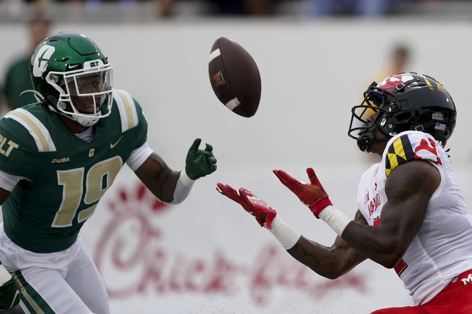 Maryland wide receiver Jacob Copeland catches a touchdown pass in front of Charlotte defensive back Comanche Francisco during the first half of an NCAA college football game on Saturday, Sept. 10, 2022, in Charlotte, N.C. (AP Photo/Chris Carlson)