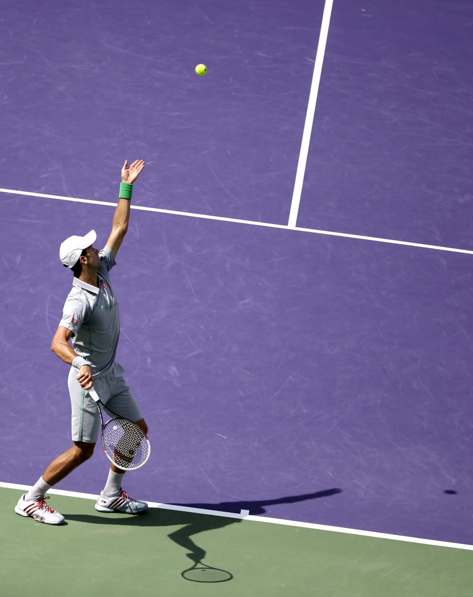 Novak Djokovic, of Serbia, serves to Rafael Nadal, of Spain, during the men's final match at the Sony Open Tennis tournament on Sunday, March 30, 2014, in Key Biscayne, Fla. (AP Photo/Lynne Sladky)