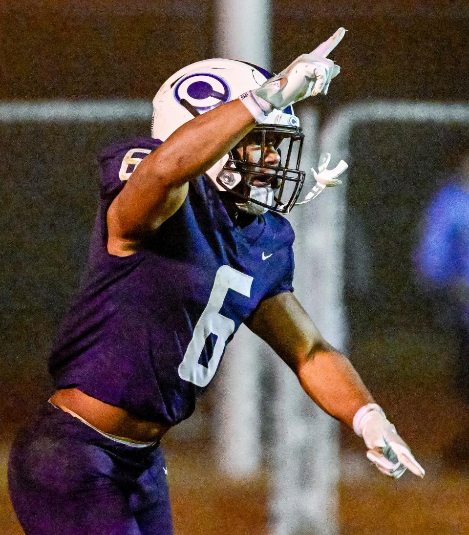 Central Valley Christian's Bryson Donelson celebrates a touchdown against Hanford in a Central Section Division II high school semifinal football playoff Friday, November 18, 2022.