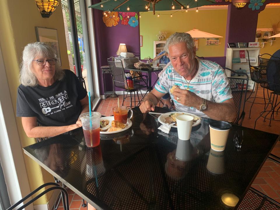 Robin and Gino Butto enjoy lunch Wednesday at Ossorio Cafe & Bakery. The Cocoa Village restaurant was open until 2 p.m. so diners could get lunch and breakfast before Hurricane Nicole brought tropical storm-force winds to the area.