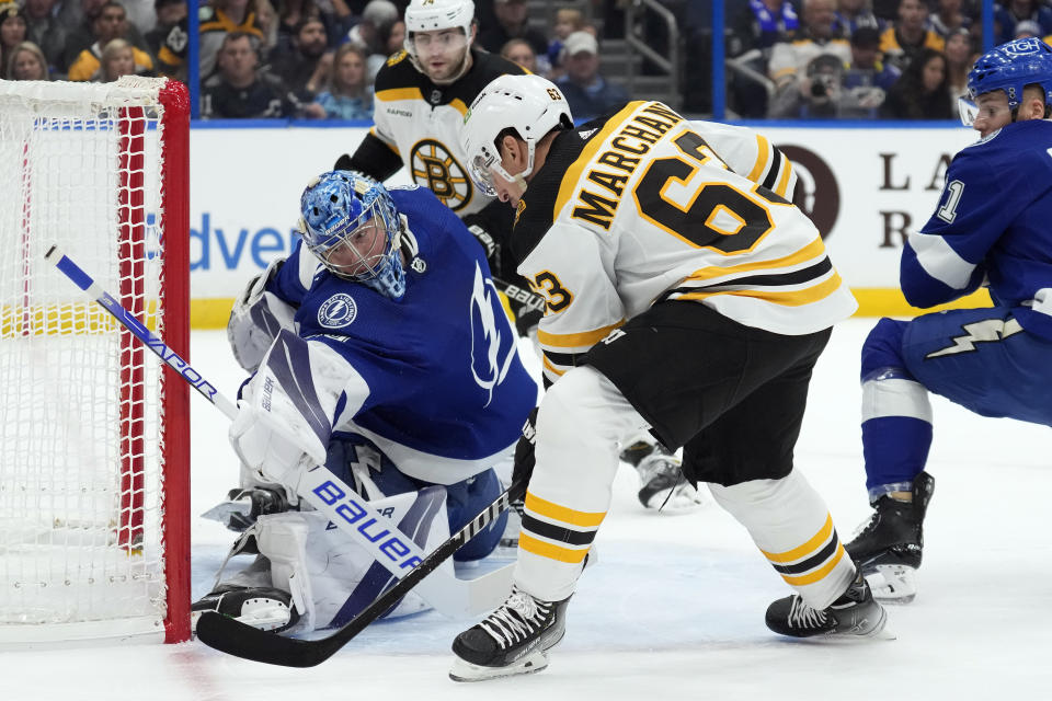 Tampa Bay Lightning goaltender Andrei Vasilevskiy (88) stops a shot by Boston Bruins left wing Brad Marchand (63) during the first period of an NHL hockey game Monday, Nov. 21, 2022, in Tampa, Fla. (AP Photo/Chris O'Meara)