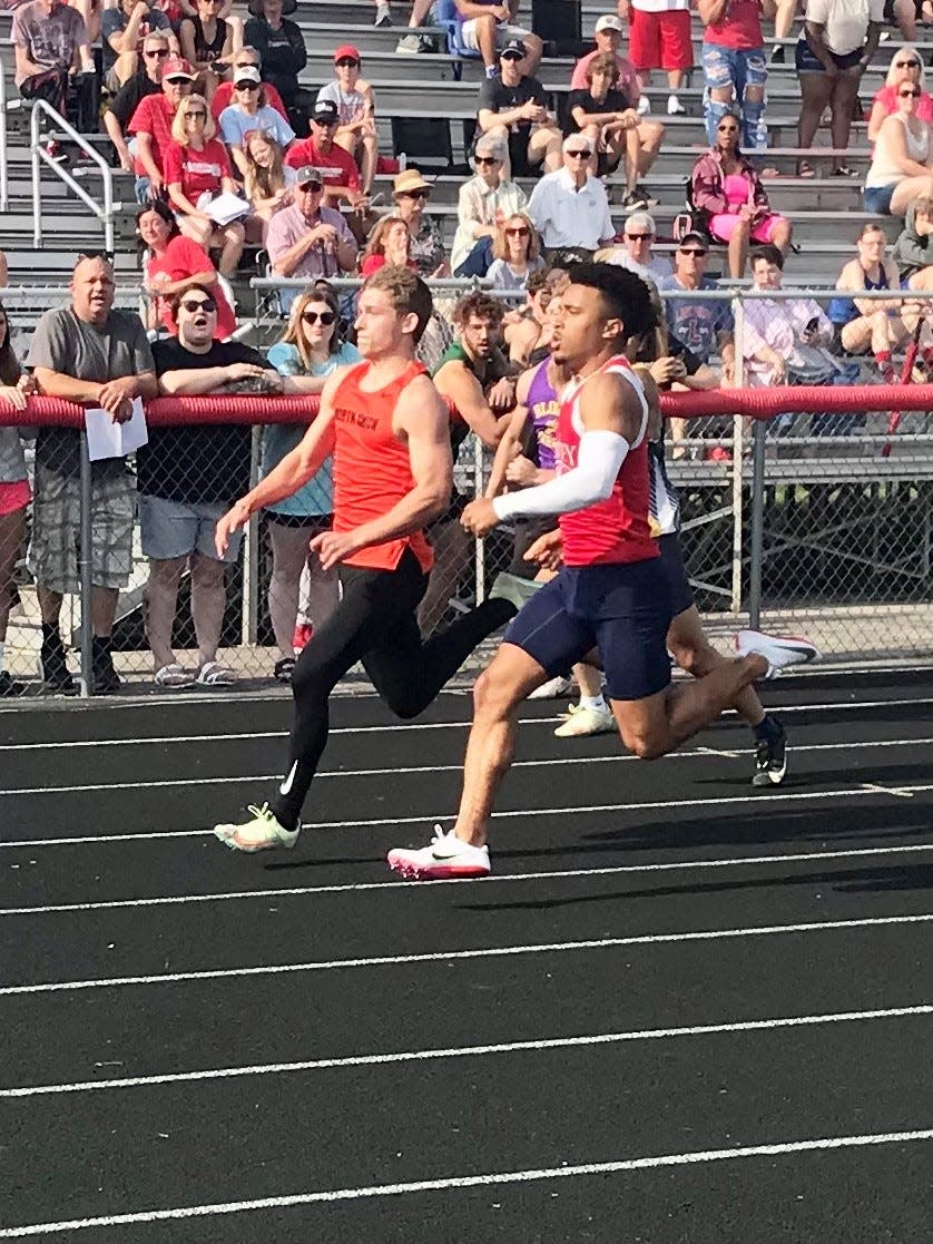 North Union's Lincoln Harrah, left, runs in the Division II boys 100-meter district race last year at Westerville South.