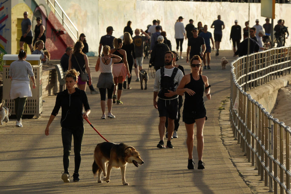 Two new cases were confirmed at schools in Sydney's Eastern Suburbs. Pictured is the promenade at Bondi Beach. Source: AAP