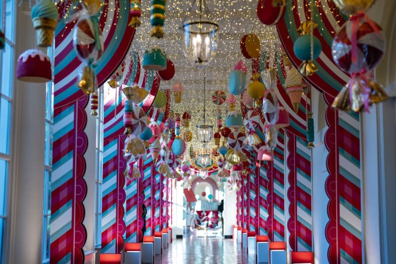 Holiday decor fills the hallway between the East Wing and the residence of the White House during a holiday media preview Washington, D.C., on Monday. First Lady Jill Biden announced the 2023 White House holiday theme: The "Magic, Wonder, and Joy" of the holidays. Photo by Leigh Vogel/UPI