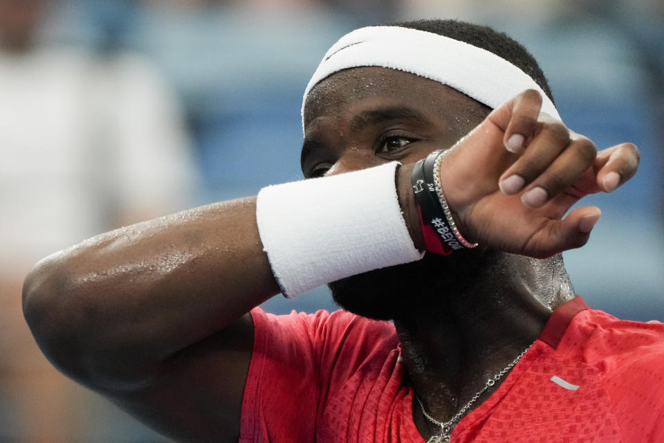 United States' Frances Tiafoe wipes the sweat from his face during his Group C match against Germany's Oscar Otte at the United Cup tennis event in Sydney, Australia, Tuesday, Jan. 3, 2023. (AP Photo/Mark Baker)