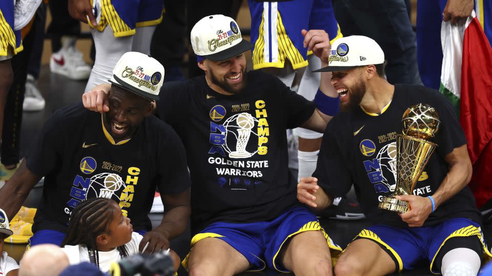 Green, Thompson and Curry celebrates the Warriors' 2022 championship victory. - Adam Glanzman/Getty Images