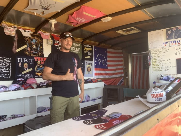 Don Caple sells face masks from the Trump Trailer outside Cadillac Ranch in Amarillo, Texas.