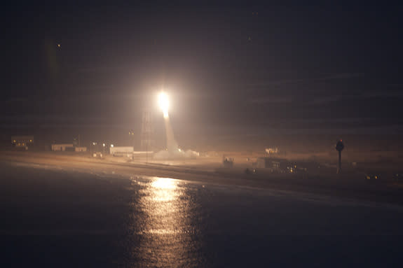 A NASA Terrier-Improved Orion sounding rocket roars toward space on a mission to create glowing red clouds above Earth on Jan. 29, 2013. The rocket launched from NASA's seaside Wallops Flight Facility on Wallops Island, Va.