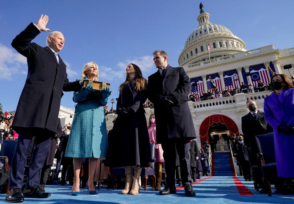 Joe Biden is sworn in as the 46th president of the United States by Chief Justice John Roberts as Jill Biden holds the Bible during the 59th Presidential Inauguration at the U.S. Capitol in Washington on Wednesday as their children Ashley and Hunter watch.