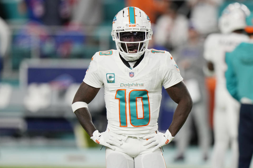 Miami Dolphins wide receiver Tyreek Hill (10) warms up before an NFL football game against the Buffalo Bills, Sunday, Jan. 7, 2024, in Miami Gardens, Fla. (AP Photo/Wilfredo Lee)