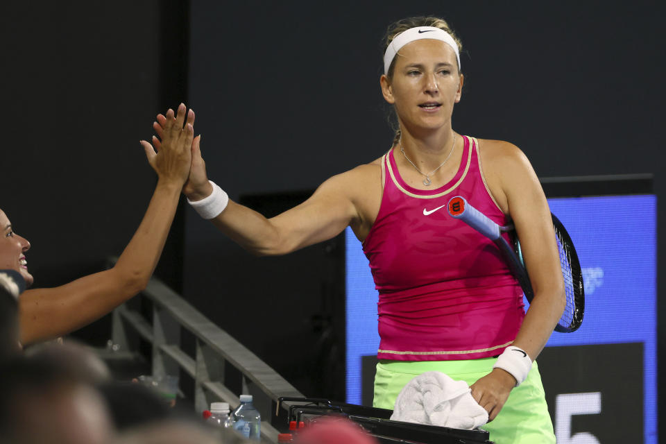 Victoria Azarenka of Belarus gestures with a spectator in her semi-final match against Aryna Sabalenka of Belarus during the Brisbane International tennis tournament in Brisbane, Australia, Saturday, Jan. 6, 2024. (AP Photo/Tertius Pickard)