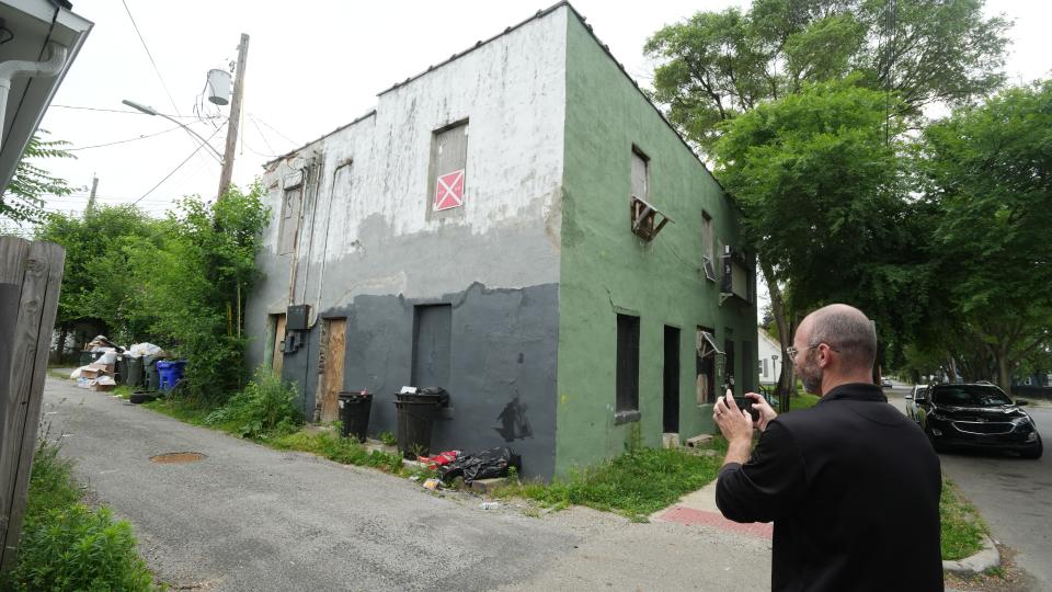 City of Columbus code enforcement officer Matthew Mercer inspects a building with multiple code violations at 160 E. Barthman Ave. on the South Side.