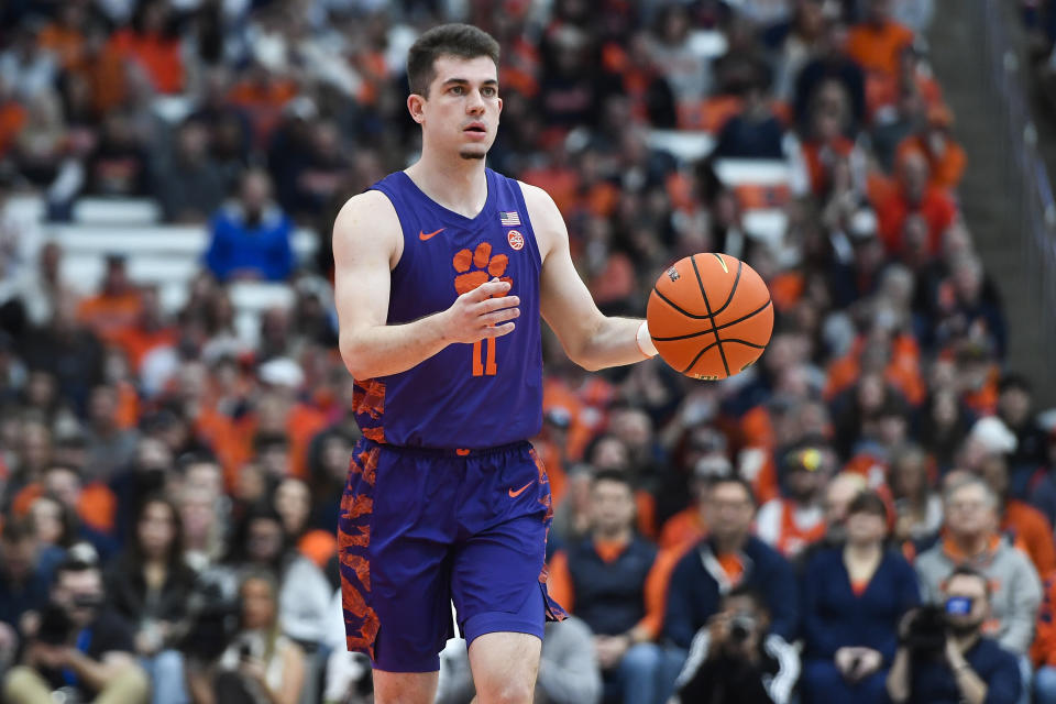 Clemson guard Joseph Girard III handles the ball during the first half of an NCAA college basketball game against Syracuse in Syracuse, N.Y., Saturday, Feb. 10, 2024. (AP Photo/Adrian Kraus)