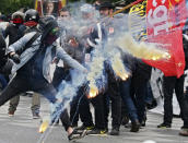 <p>Protesters clash with riot police during a demonstration against French labor law reforms in Paris on May 17, 2016. (Gonzalo Fuentes/Reuters)</p>