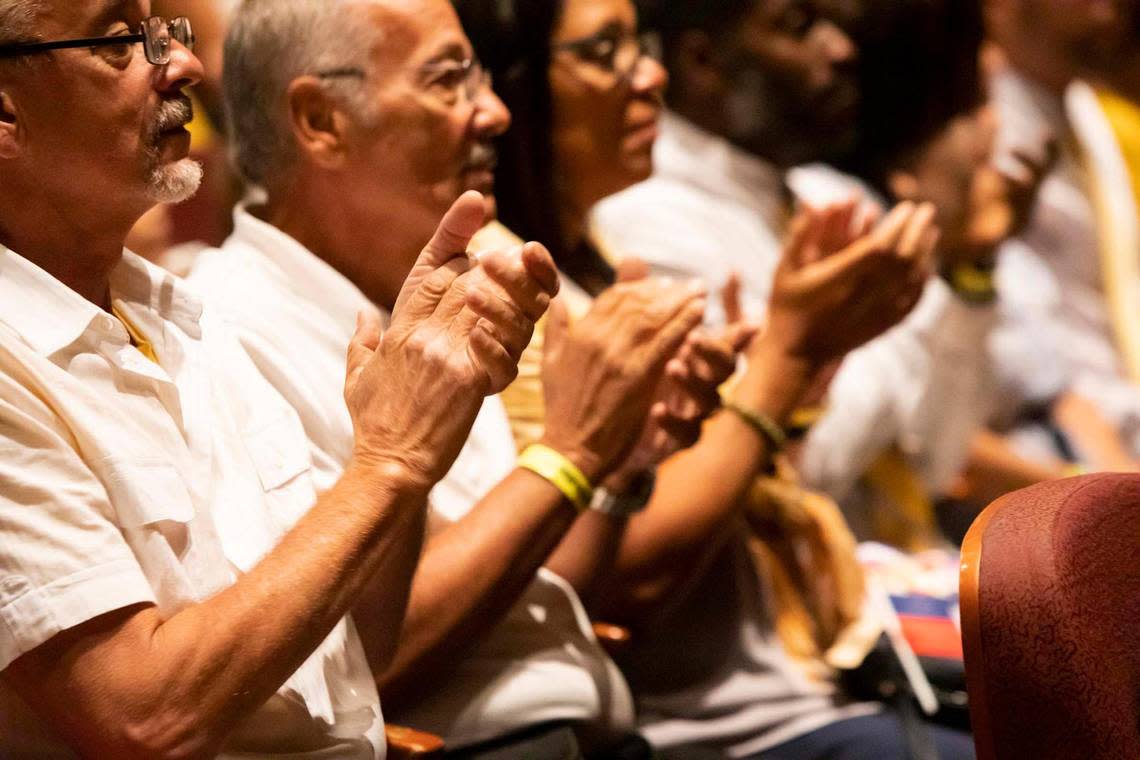 The crowd reacts at the memorial service in Miramar on Sunday held for Haitian singer Mikaben, who died in Paris three weeks ago.