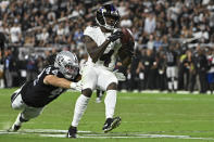 Baltimore Ravens wide receiver Sammy Watkins (14) makes a catch Las Vegas Raiders inside linebacker Nick Kwiatkoski (44) during the second half of an NFL football game, Monday, Sept. 13, 2021, in Las Vegas. (AP Photo/David Becker)