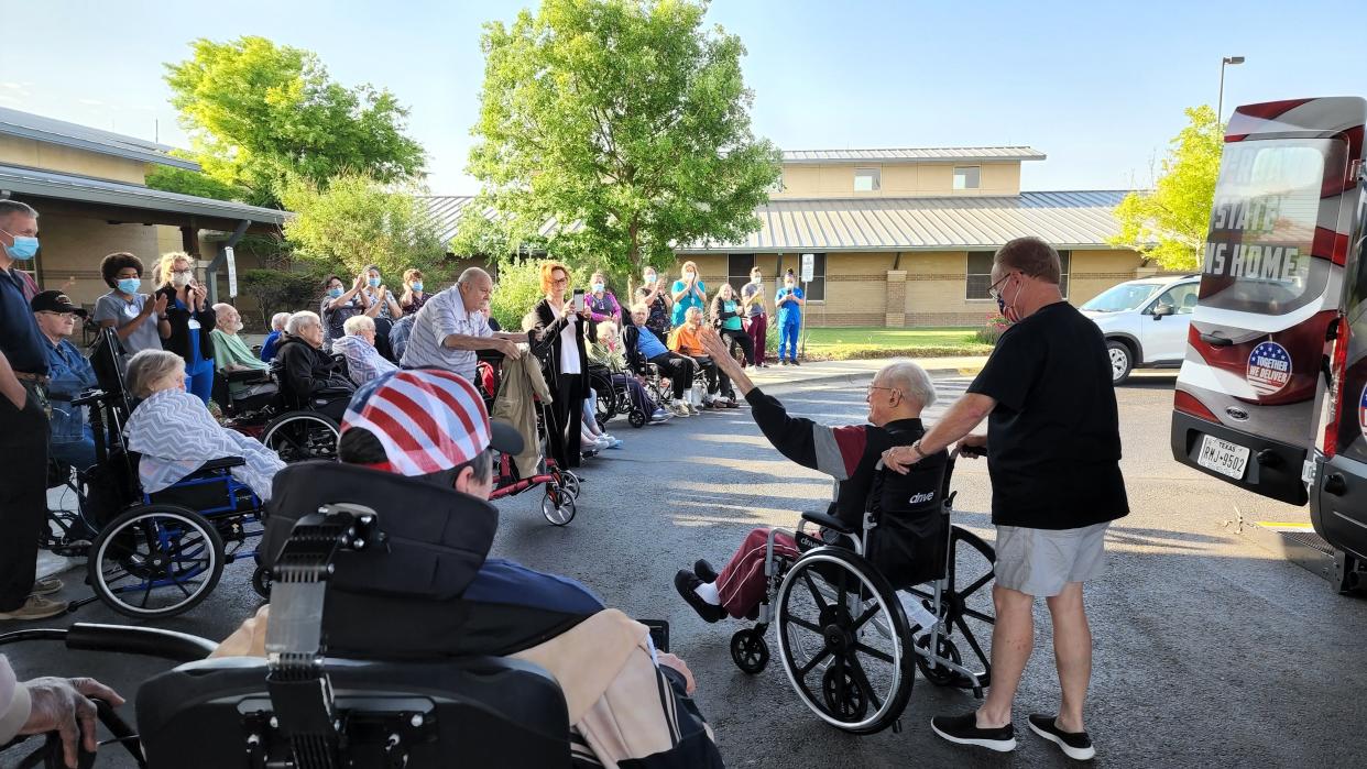 Cleatus Lebow waves to his supporters May 16 at the Ussery-Roan Texas State Veterans Home as he departs for the USS Indianapolis Reunion in Fredericksburg. Lebow, 98, died Sept. 29.