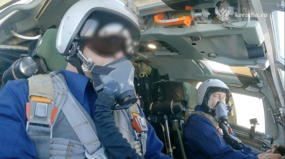 Russian President Vladimir Putin, at right, takes a flight on board a modernized Tu-160M strategic bomber, which took off from the runway of the Kazan Aviation Plant in the Republic of Tatarstan, Russia, Feb. 22, 2024. / Credit: Kremlin Press Office/Handout/Anadolu/Getty