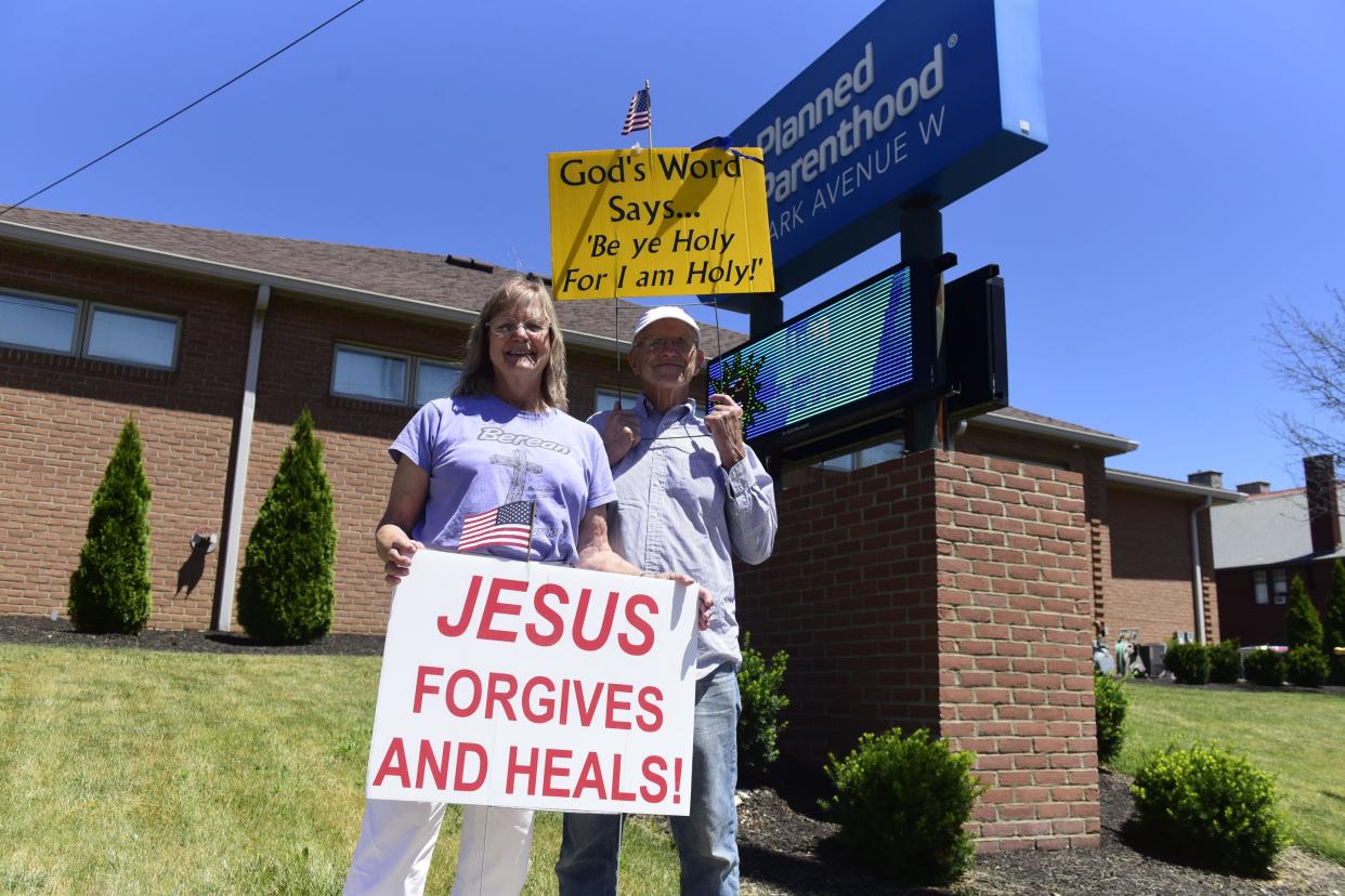 Two decades after they met at an abortion protest, Ted and Nancy Ryan celebrated Friday's overturn of Roe v. Wade outside the Planned Parenthood office in Mansfield.