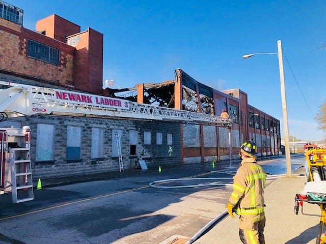 Newark Fire and other departments respond to a blaze at Newark Station on West Main Street early Easter Sunday morning April 17, 2022.