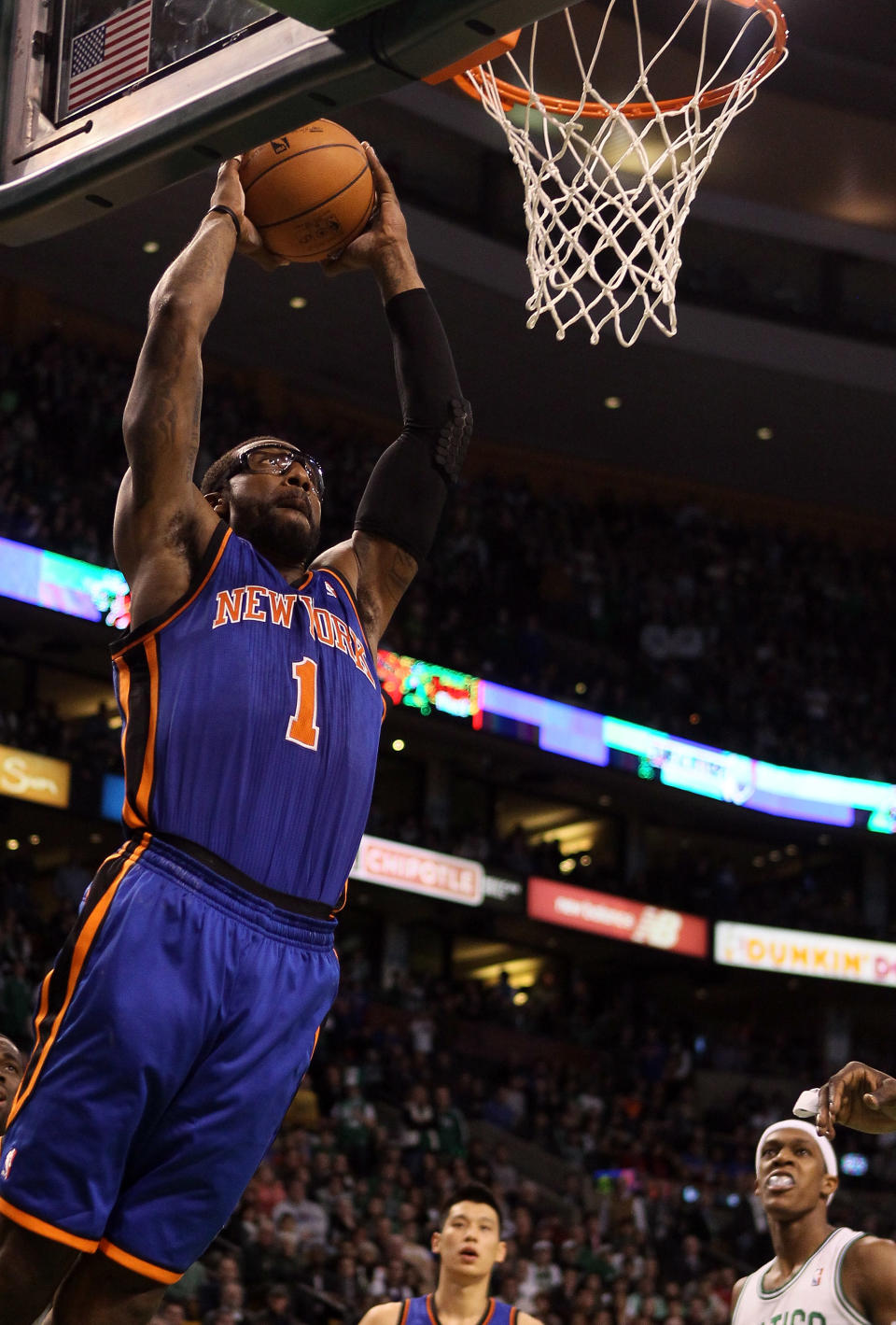 BOSTON, MA - MARCH 04: Amare Stoudemire #1 of the New York Knicks dunks the ball in the second half against the Boston Celtics on March 4, 2012 at TD Garden in Boston, Massachusetts. The Boston Celtics defeated the New York Knicks 115-111 in overtime. NOTE TO USER: User expressly acknowledges and agrees that, by downloading and or using this photograph, User is consenting to the terms and conditions of the Getty Images License Agreement. (Photo by Elsa/Getty Images)