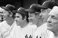 FILE- In this Aug. 3, 1974, file photo, New York Yankees, from left, Mickey Mantle, Yogi Berra, Whitey Ford, Joe DiMaggio and Casey Stengel gather on the steps of Shea Stadium in New York before an Old Timer's game. A family member tells The Associated Press on Friday, Oct. 9, 2020 that Ford died at his Long Island home Thursday night. (AP Photo/Ray Stubblebine, File)