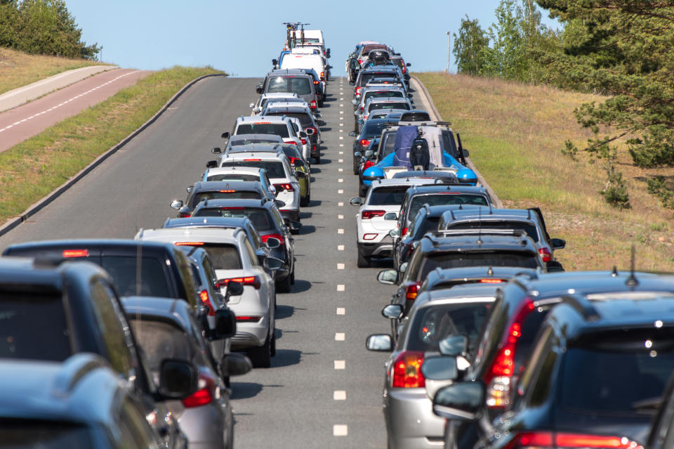 Cars are seen lined up in a traffic jam on a highway, as Victoria unveils digital driver licences. 