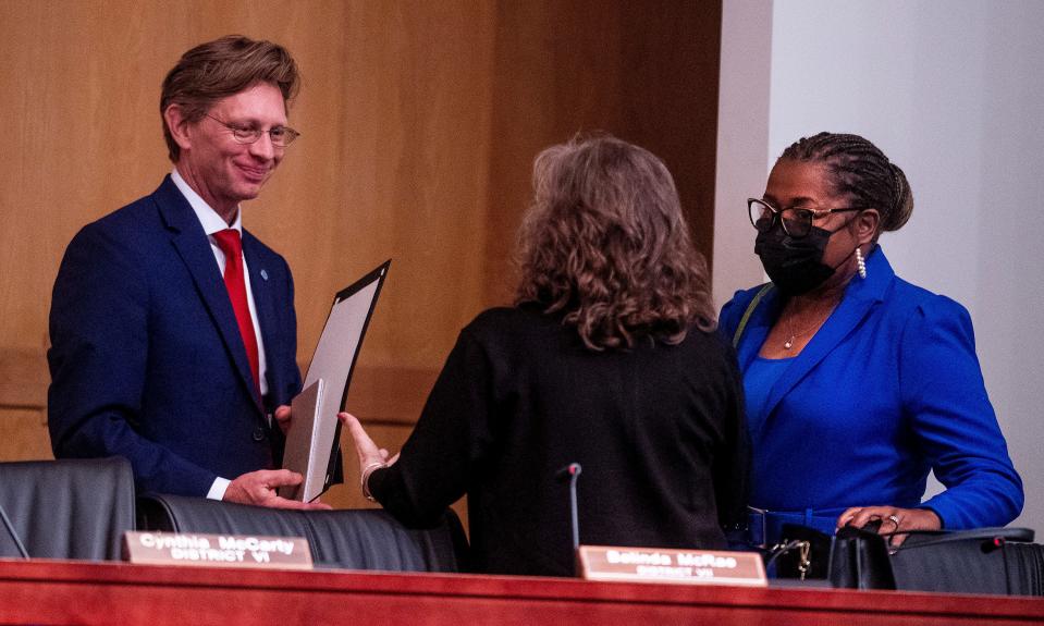 Alabama Superintendent of Education Eric Mackey, left, and Tonya Chestnut, of the Alabama State Board of Education, right, following their meeting in Montgomery, Ala., on Thursday May 13, 2021.