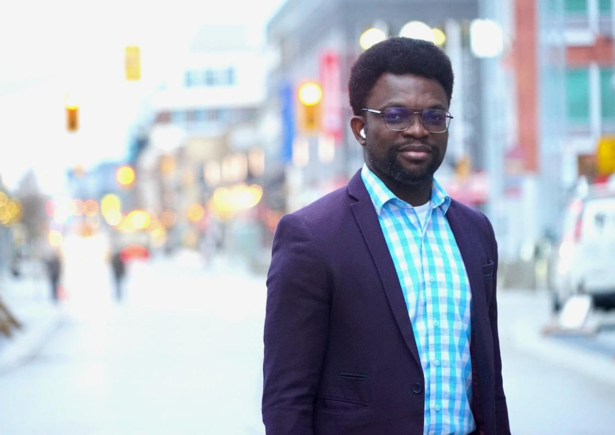 Kingsley Madu created the financial app Expedier, which helps remove the financial barriers immigrants face in moving to Canada. (Carmen Groleau/CBC - image credit)