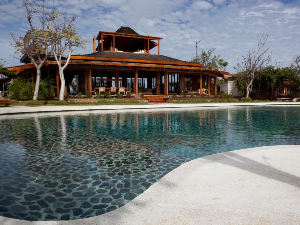 The Opium villa in Mustique with a pool outside
