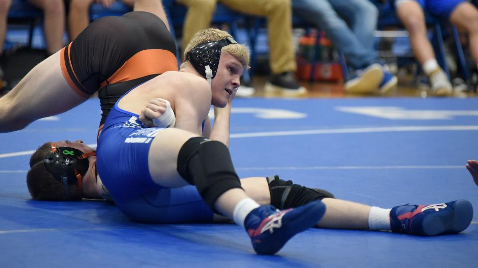 Aiden Davis, shown pinning Hudson's Aden Barrett, was one of three Dundee wrestlers with two pins during the Vikings' domination of the Division 3 District at Flat Rock.