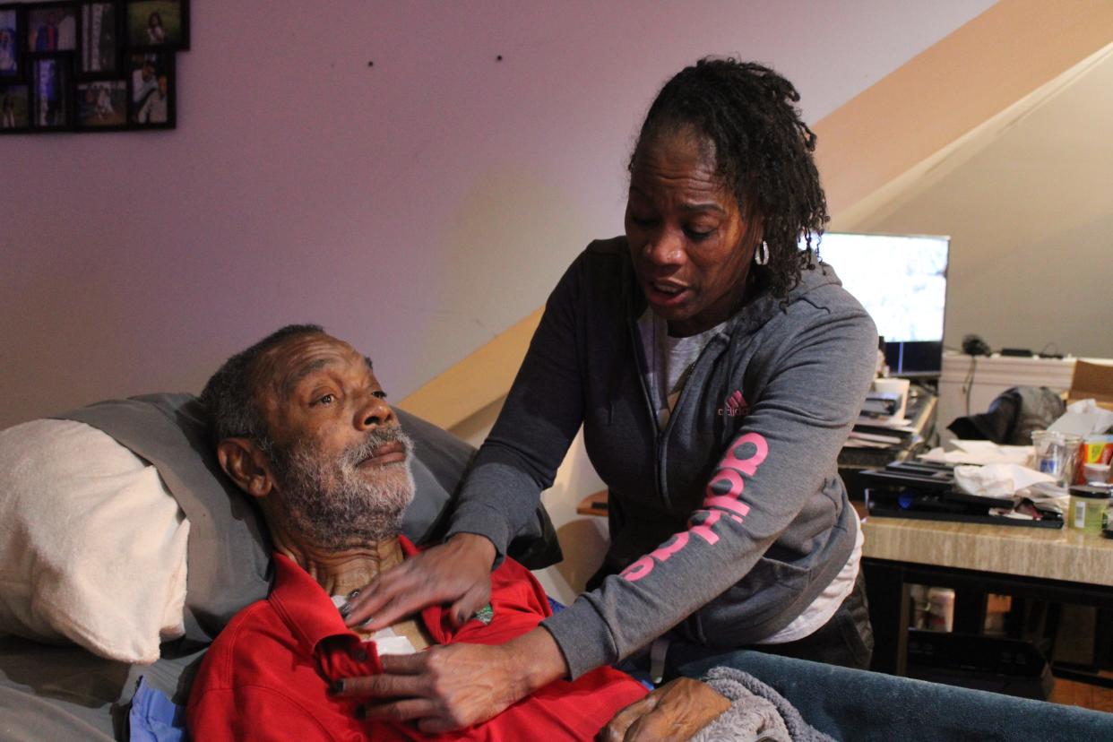 Nurse Demetrice Owens cares for Jewel Currie, owner of the bar Garfield's 502, during a nursing shift on Nov. 27.