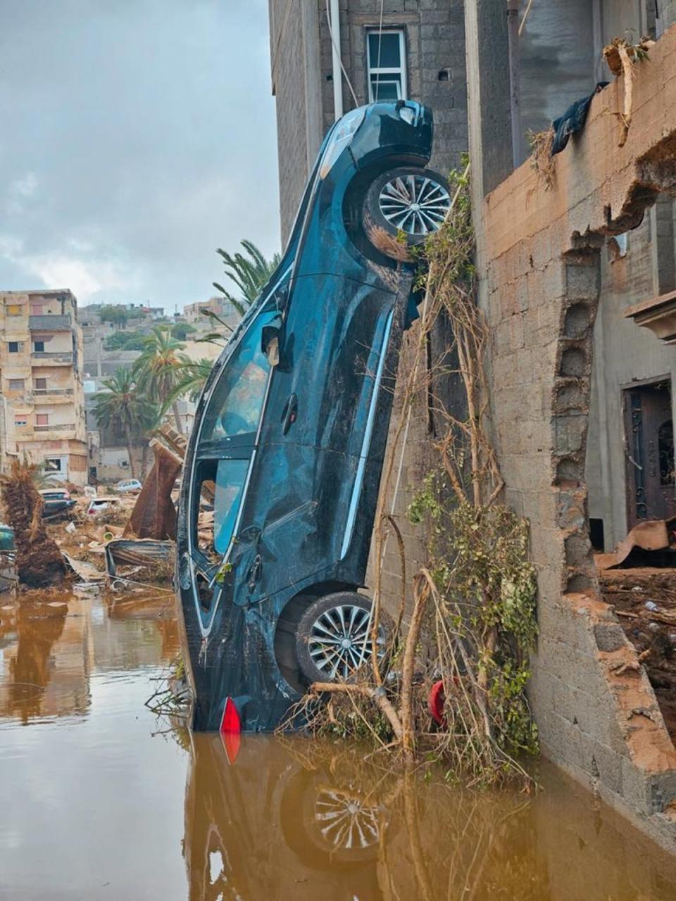 The force of the floodwater was strong enough to upend cars (Supplied)