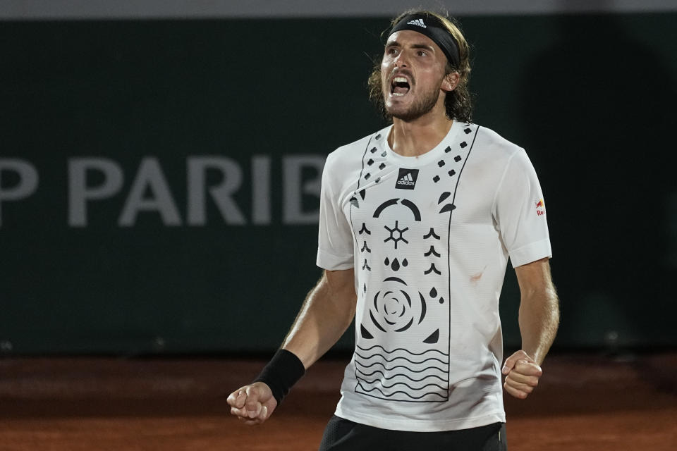 Greece's Stefanos Tsitsipas shouts as he defeats Zdenek Kolar of the Czech Republic during their second round match of the French Open tennis tournament at the Roland Garros stadium Thursday, May 26, 2022 in Paris. (AP Photo/Michel Euler)