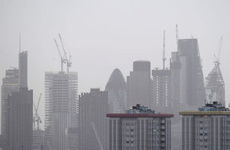 FILE PHOTO: Construction work is seen on high-rise office blocks in the City of London in London, Britain, January 25, 2018. Picture taken January 25, 2018. REUTERS/Toby Melville/File Photo