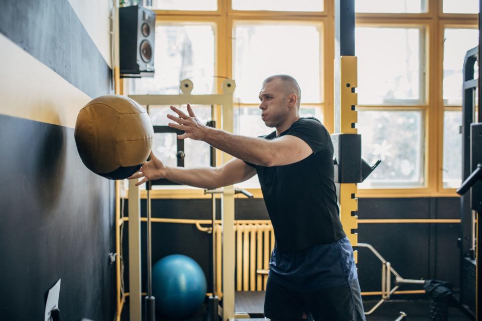 man training with medicine ball