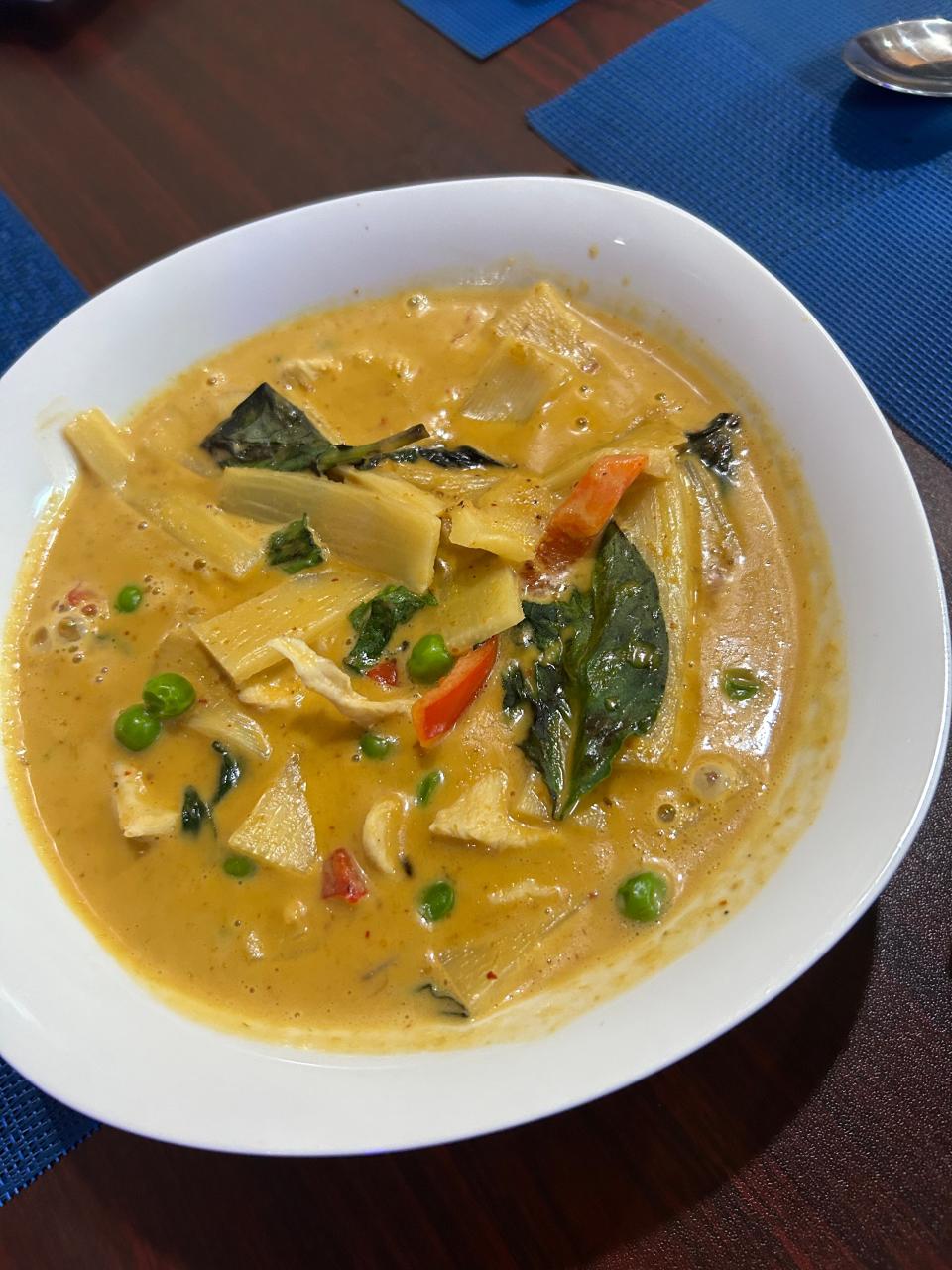 Red curry at Lyeh Thai is made with Thai traditional green curry paste with coconut milk, bamboo shoots, peas, basil leaves and red bell pepper.
