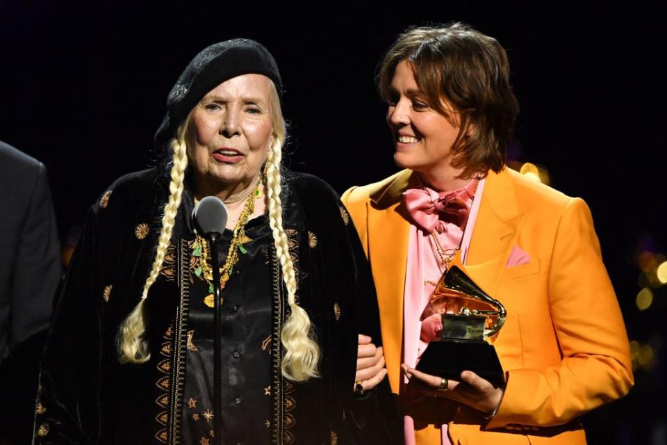 canadian singer songwriter joni mitchell accepts the best folk album award for joni mitchell at newport live with us singer songwriter brandi carlile onstage during the 66th annual grammy awards pre telecast show at the cryptocom arena in los angeles on february 4, 2024 photo by valerie macon afp photo by valerie maconafp via getty images