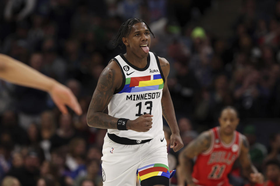 Minnesota Timberwolves forward Nathan Knight (13) reacts after making a basket during the first half of an NBA basketball game against the Chicago Bulls, Sunday, Dec. 18, 2022, in Minneapolis. (AP Photo/Stacy Bengs)