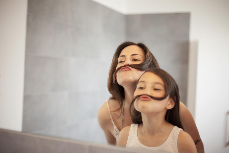 mother and daughter in bath