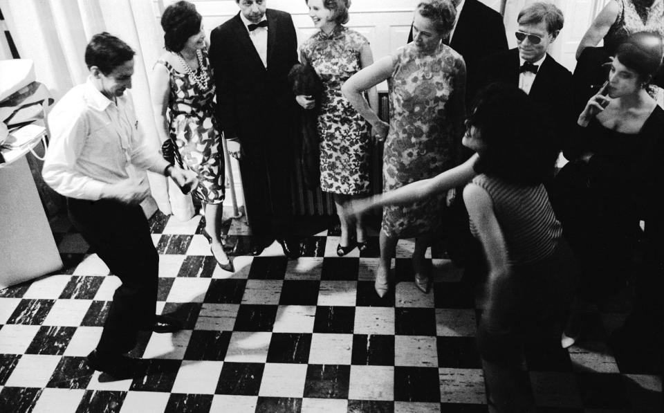 Socialite: Robert Rauschenberg dancing The Twist in front of Andy Warhol, 1963