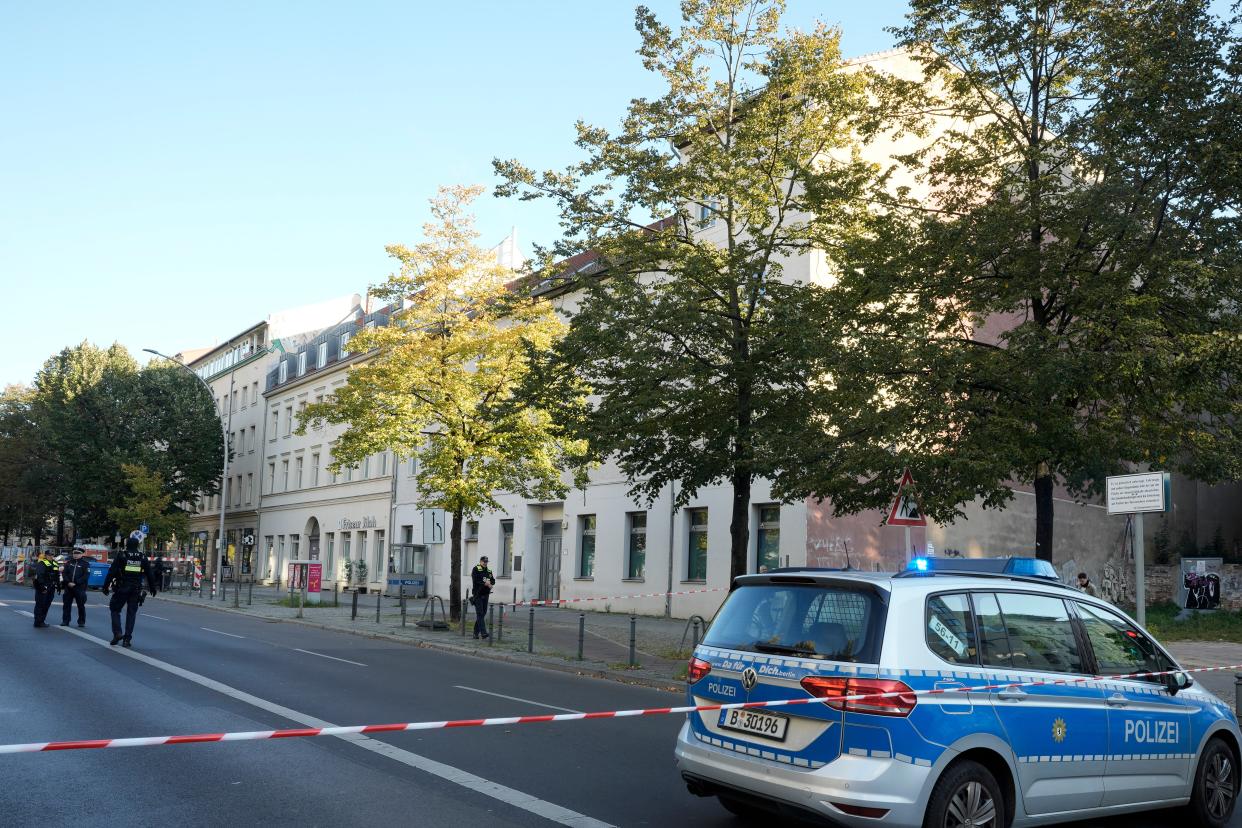 German police officers stand guard in front of the building complex, center, of the Kahal Adass Jisroel community (Copyright 2023 The Associated Press. All rights reserved)