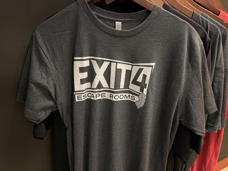 Exit 4 Escape Rooms T-shirts are shown at Exit 4 Private Escape Rooms in Collingswood.