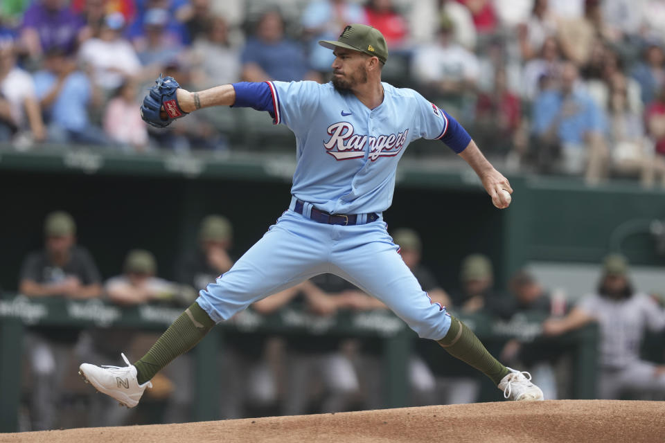 Texas Rangers starting pitcher Andrew Heaney throws during the first inning of a baseball game against the Colorado Rockies in Arlington, Texas, Sunday, May 21, 2023. (AP Photo/LM Otero)